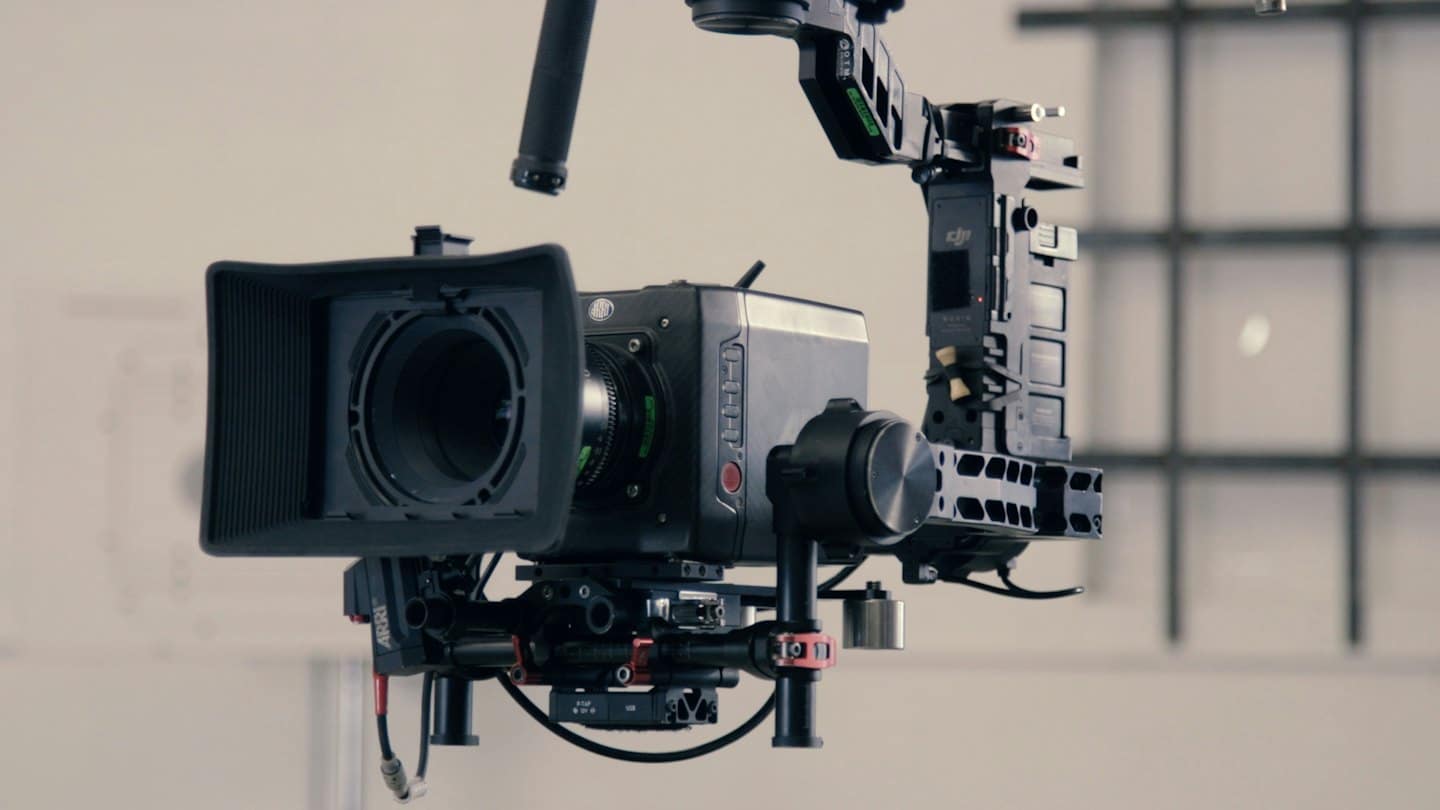 Professional cinema camera on a complex gimbal rig system.